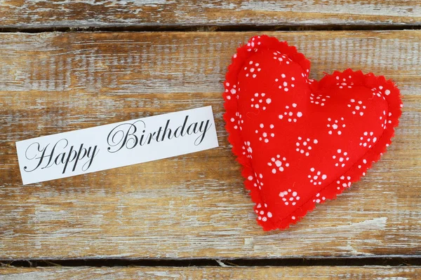 Happy birthday card with red heart on wooden surface — Stock Photo, Image