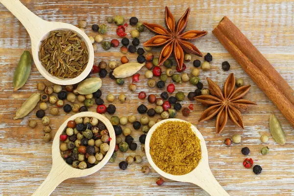 Indian spices on wooden surface — Stock Photo, Image