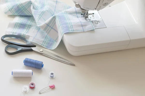 Sewing machine part, fabric, threads and accessories for sewing close-up — Stock Photo, Image