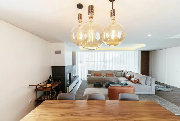 Living room modern interior design with grey colours, white walls and big lamps