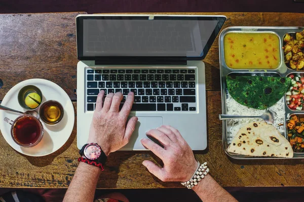 Arms Freelancer Working Laptop Computer Eating Indian Food Set Wooden — ストック写真