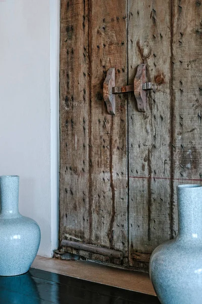 Old style interior details in luxury interior. Wooden door
