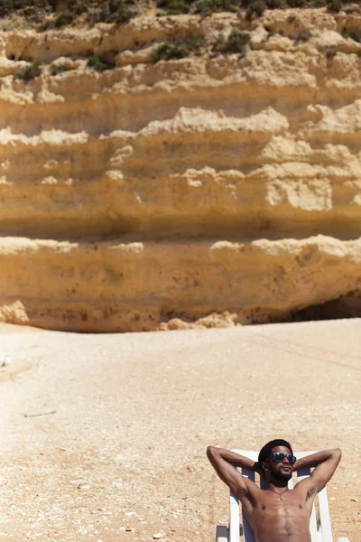 Young Happy Man Lying Ocean Shore Enjoying Summer Holiday Dark — Stock Photo, Image