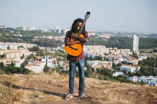 Outdoor emotional Fashion Portrait of African man wearing long