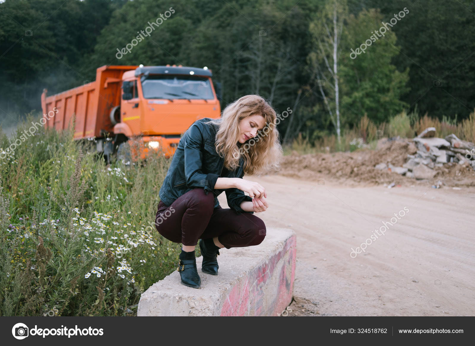 Woman Wearing Leather Jacket Seating Field Road Big Truck Industrial Stock  Photo by ©AnnaTamila 324518762