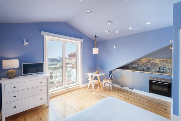 Modern apartment interior design in blue colours, balcony, kitchen, small and cozy room