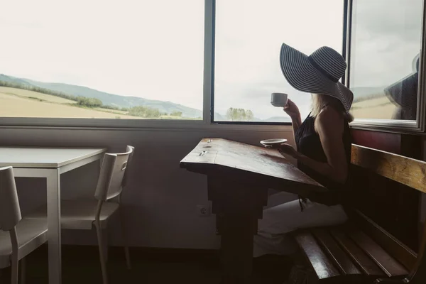 Woman Wearing Big Hat Seating Retro Cafe Opened Window — 스톡 사진