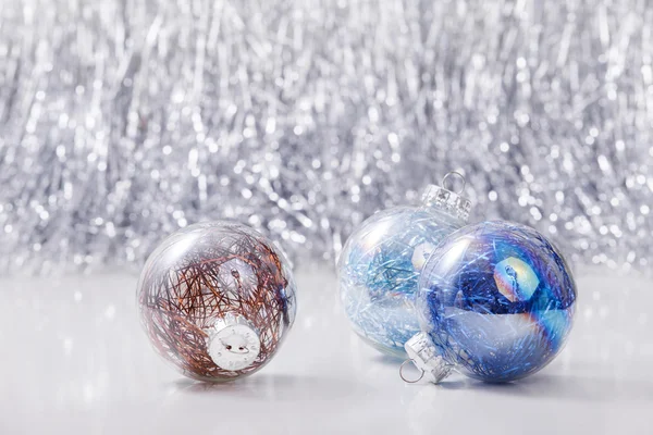 Silver and Blue Christmas ornaments balls on glitter bokeh background with space for text. Xmas and Happy New Year theme Royalty Free Stock Images