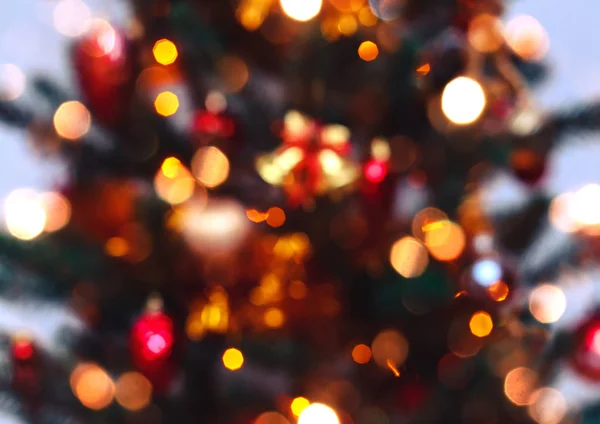 Fundo da árvore de Natal com borrado, faísca, brilhante. Feliz Ano Novo e tema de Natal — Fotografia de Stock