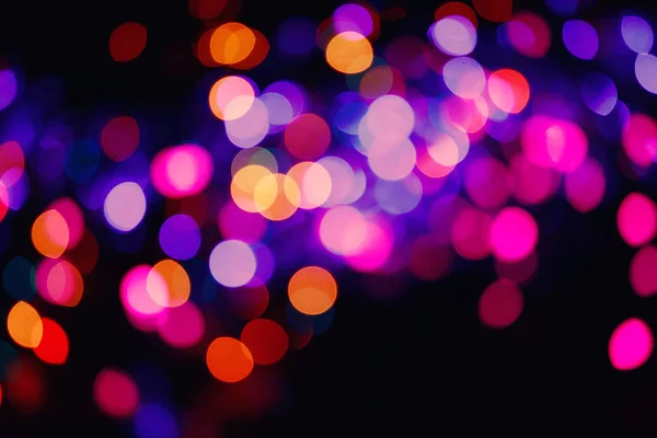 キラキラ ライトの背景。ホリデイ ・ ボケ味のテクスチャです。色とりどりの光。デフォーカス — ストック写真