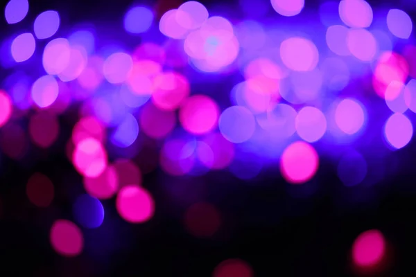 キラキラ ライトの背景。ホリデイ ・ ボケ味のテクスチャです。色とりどりの光。デフォーカス — ストック写真