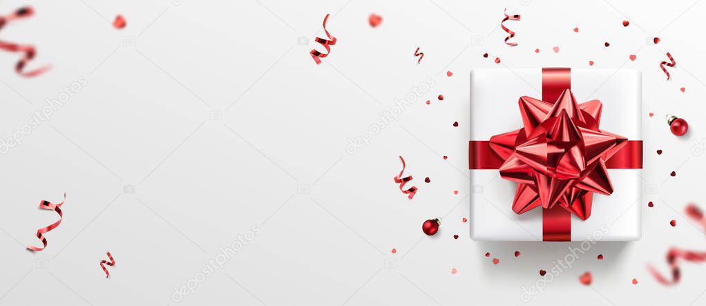 White gift box with red ribbon and bow, red decoration, sparkles, confetti on white background. Merry Christmas and Xmas card. Happy Birthday postcard, top view, realistic vector