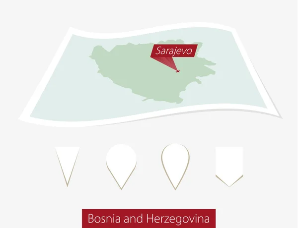 Mapa de papel curvo de Bósnia e Herzegovina com a capital Sarajevo no fundo cinza . — Vetor de Stock