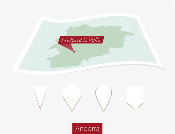 Mapa en papel curvado de Andorra con capital Andorra la Vella sobre fondo gris . — Vector de stock