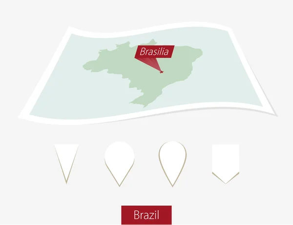 Mapa de papel curvo do Brasil com capital Brasília no fundo cinza . — Vetor de Stock