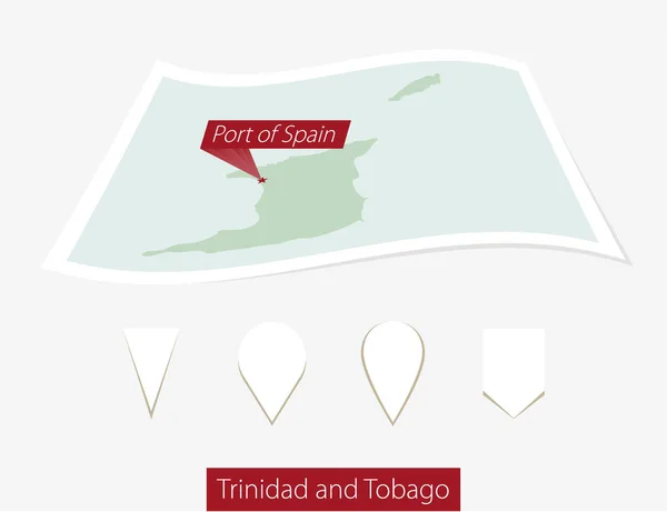Zahnutá papírovou mapu z Trinidadu a Tobaga s kapitálem Port of Spain na šedé pozadí. — Stockový vektor