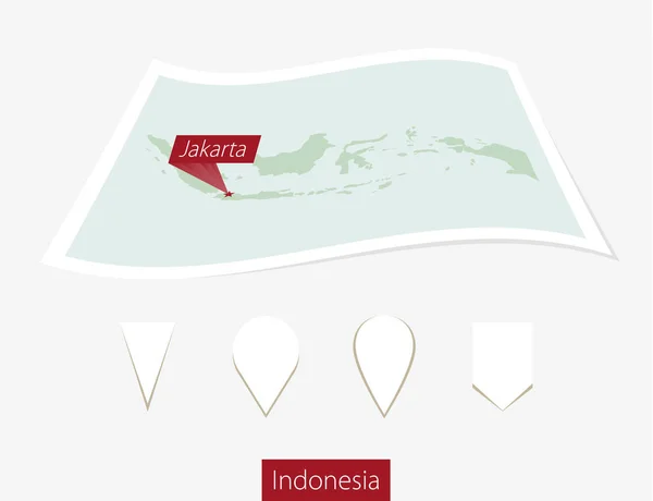 Carte papier de L'Indonésie avec la capitale Jakarta sur fond gris . — Image vectorielle