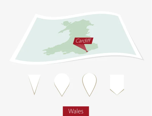 Carte papier incurvée de Pays de Galles avec capitale Cardiff sur fond gris . — Image vectorielle
