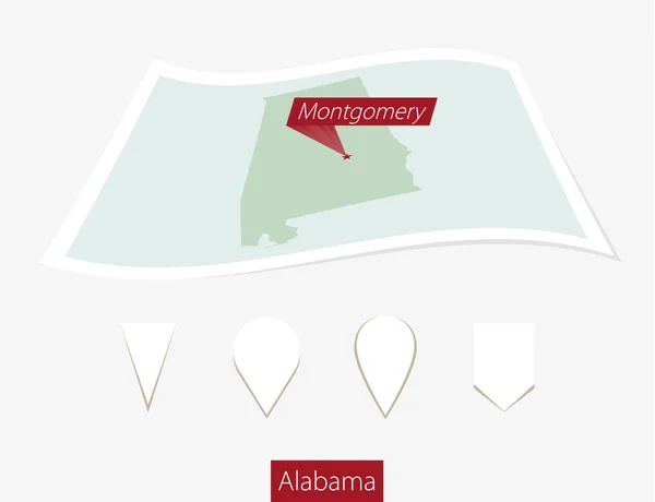 Zahnutá papírovou mapu státu Alabama s kapitálem Montgomery na šedé pozadí. — Stockový vektor