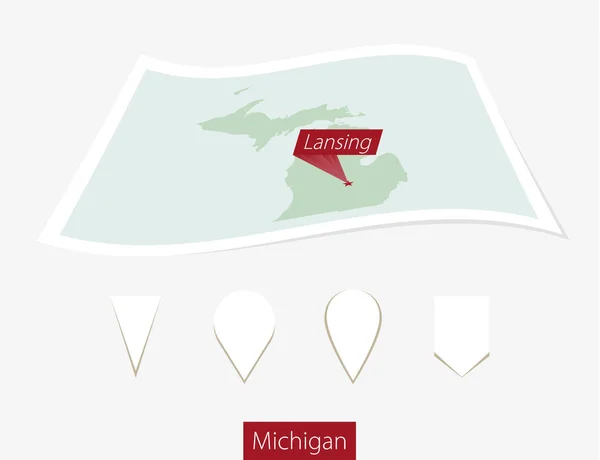 Mapa de papel curvo de Michigan com capital Lansing no fundo cinza . — Vetor de Stock