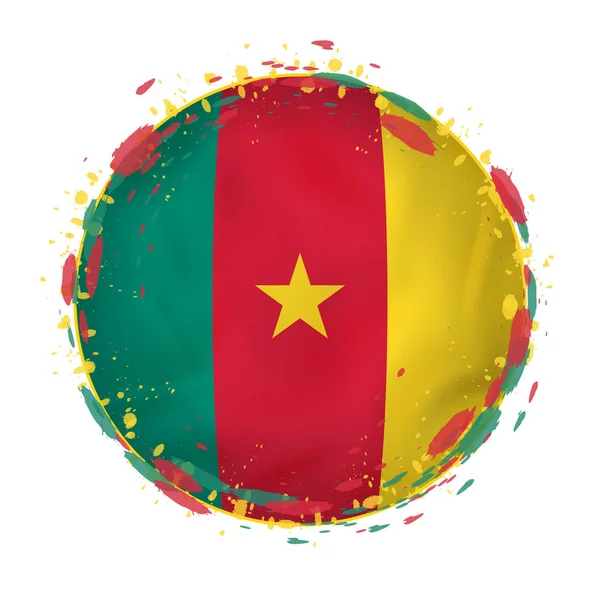 Bandiera grunge rotonda del Camerun con spruzzi di colore della bandiera . — Vettoriale Stock