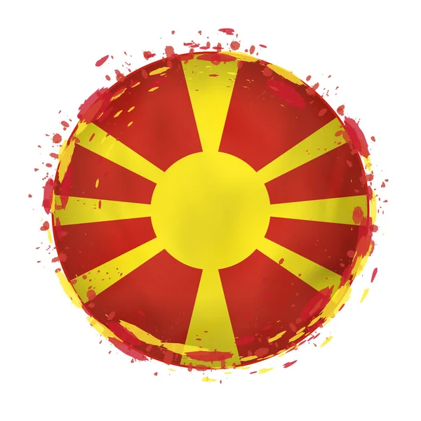 Ronde grunge vlag van Macedonië met spatten in vlagkleur. — Stockvector