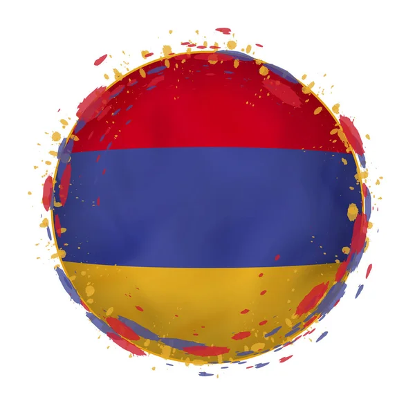 Bandera grunge redonda de Armenia con salpicaduras en el color de la bandera . — Vector de stock