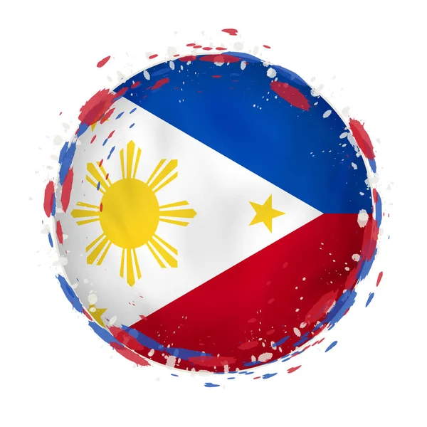 Bandera grunge redonda de Filipinas con salpicaduras en el color de la bandera . — Vector de stock