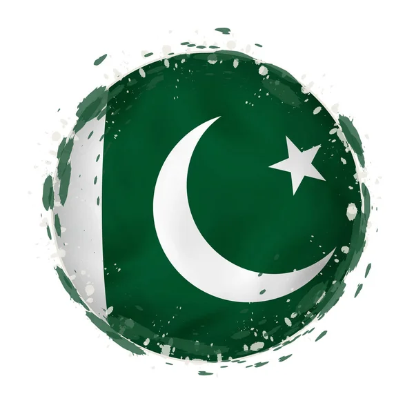 Round grunge flag of Pakistan with splashes in flag color. — Stock Vector