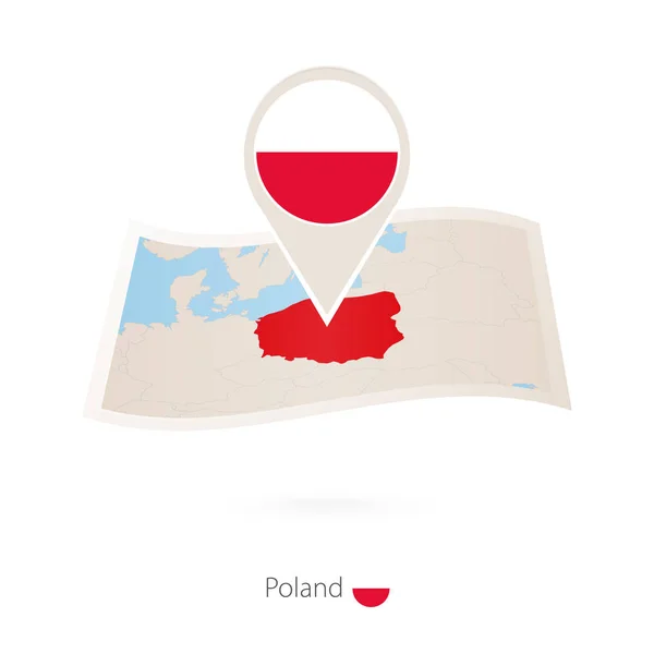 Vikta papperskarta över Polen med flagga pin av Polen. — Stock vektor