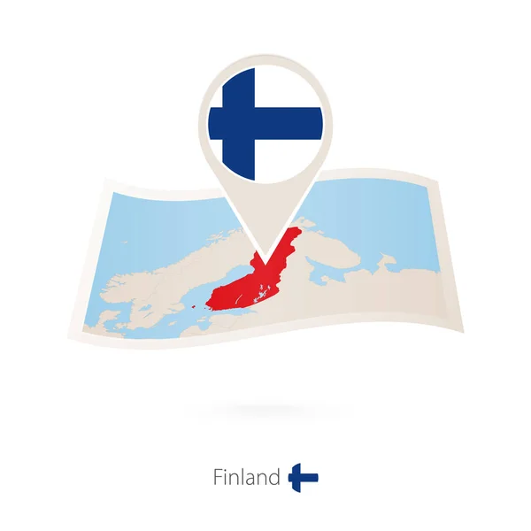 Gevouwen papieren kaart van Finland met vlag pin van Finland. — Stockvector