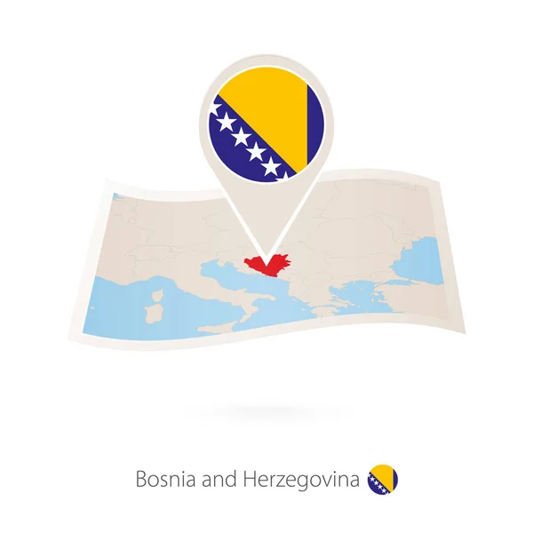Mapa en papel plegado de Bosnia y Herzegovina con pasador de bandera de Bosnia y Herzegovina — Vector de stock