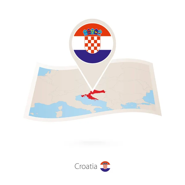 Gevouwen papieren kaart van Kroatië met vlag pin van Kroatië. — Stockvector