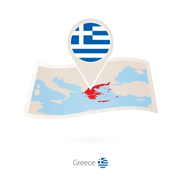 Gevouwen papieren kaart van Griekenland met vlag pin van Griekenland. — Stockvector
