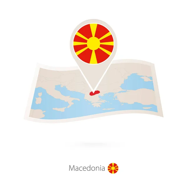 Mapa de papel dobrado de Macedônia com pino de bandeira da Macedônia . — Vetor de Stock