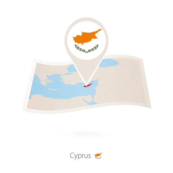 Folded paper map of Cyprus with flag pin of Cyprus. — Stock Vector