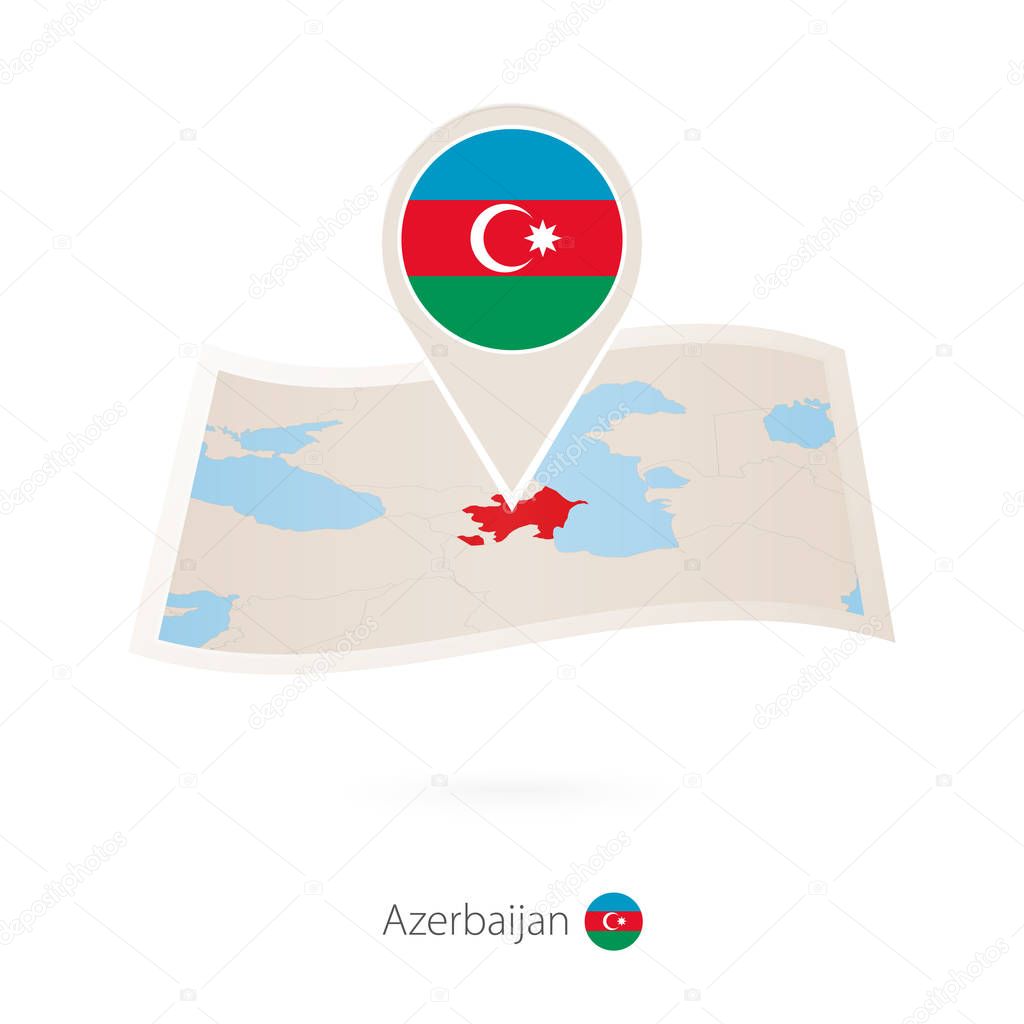 Folded paper map of Azerbaijan with flag pin of Azerbaijan.