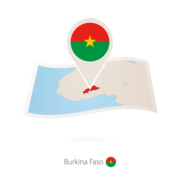 Skládané papírové mapě Burkina Faso s pin vlajka Burkiny Faso. — Stockový vektor