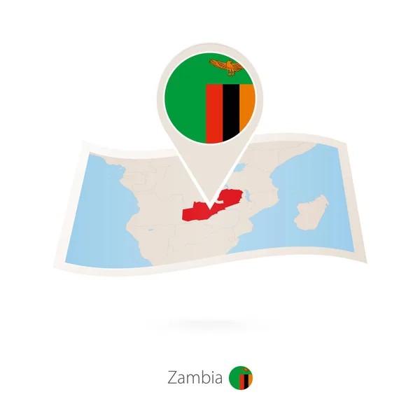 Folded paper map of Zambia with flag pin of Zambia. — Stock Vector