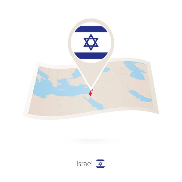 Mapa de papel dobrado de Israel com pino de bandeira de Israel . — Vetor de Stock