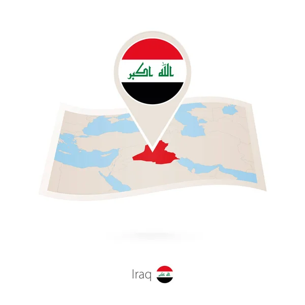 Gefaltete Papierkarte des Irak mit Fahnennadel des Irak. — Stockvektor