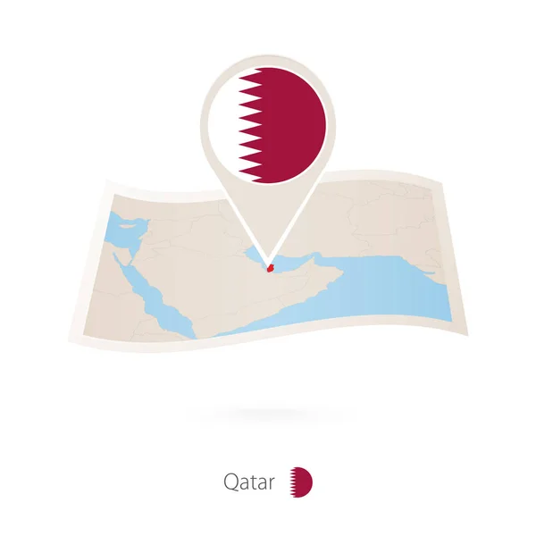 Folded paper map of Qatar with flag pin of Qatar. — Stock Vector