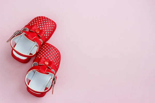 Childrens shoes on a pink background — Stock Photo, Image