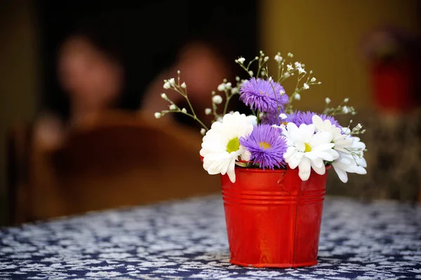 Flowers in buckets — Stock Photo, Image