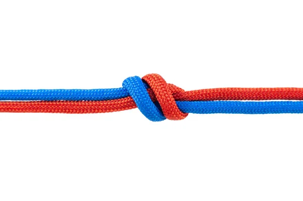 Dos Cordones Rojos Azules Están Conectados Nudo Sobre Cordón Aislado — Foto de Stock