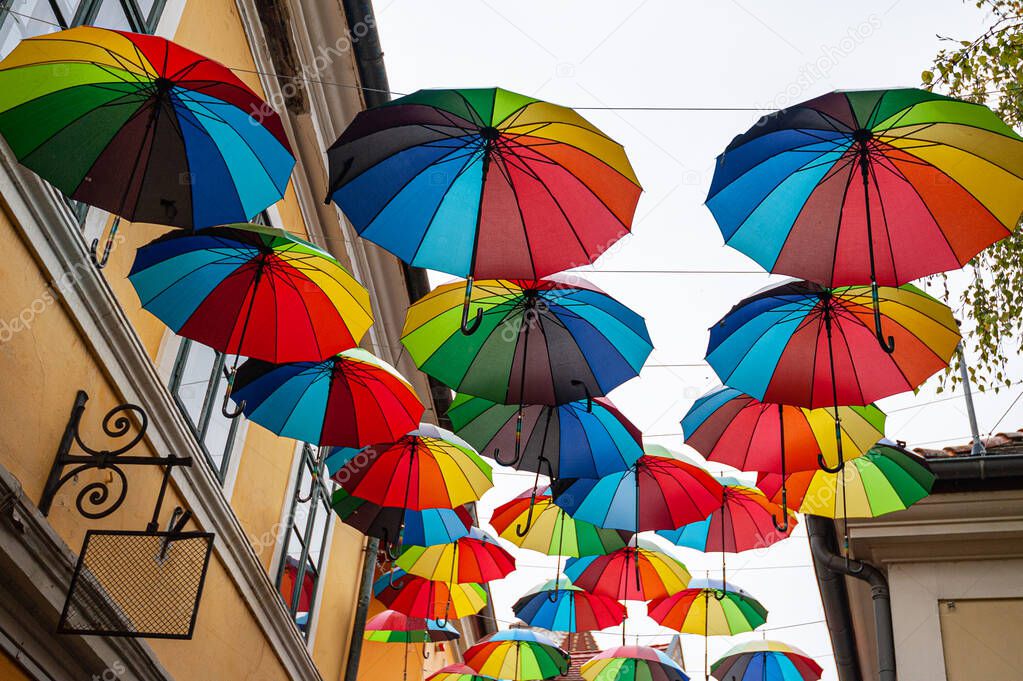 Colorful umbrellas background with blue sky in the city street decoration