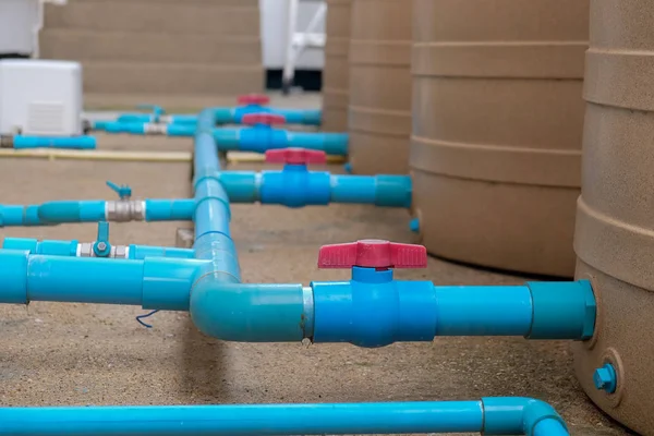 Blue water pipe installation from pump to tank. — Stock Photo, Image