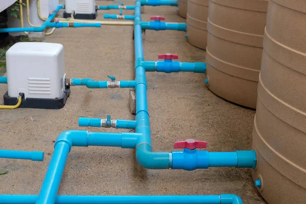 Blue water pipe installation from pump to tank. — Stock Photo, Image