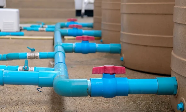 Blue water pipe installation from pump to tank. — Stock Photo, Image