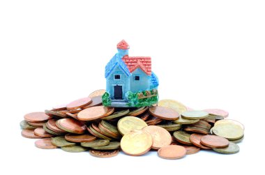 Toplamak madeni para satın almak için bir ev kavramı.